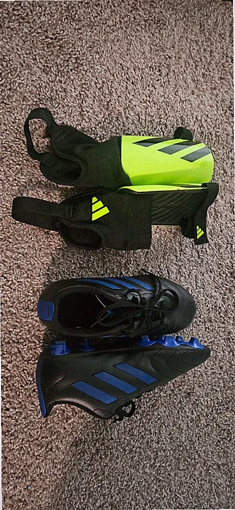 addias black and blue cleats size 3 and shin guards small boys