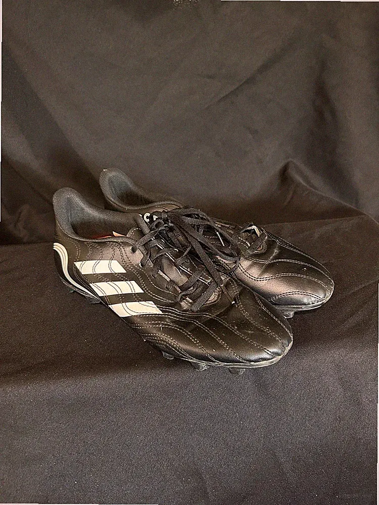 adidas Copa Sense.4 FxG soccer cleats in a core black and footwear white color