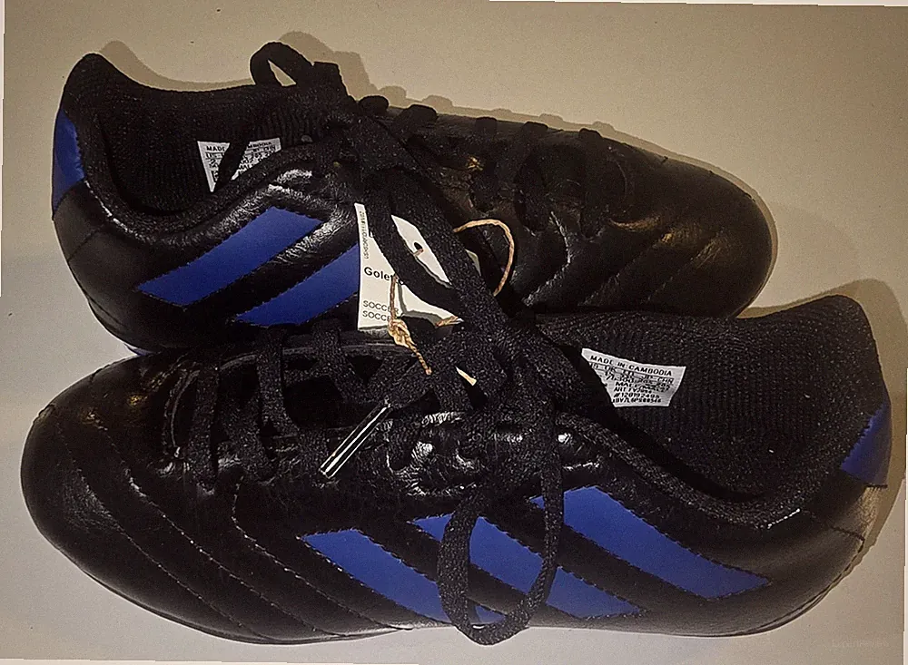 Adidas kids Goletto VII ground soccer cleats in black and royal blue. Sz.2