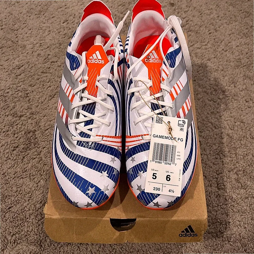Adidas Unisex GameMode FG soccer cleats in white and neon orange