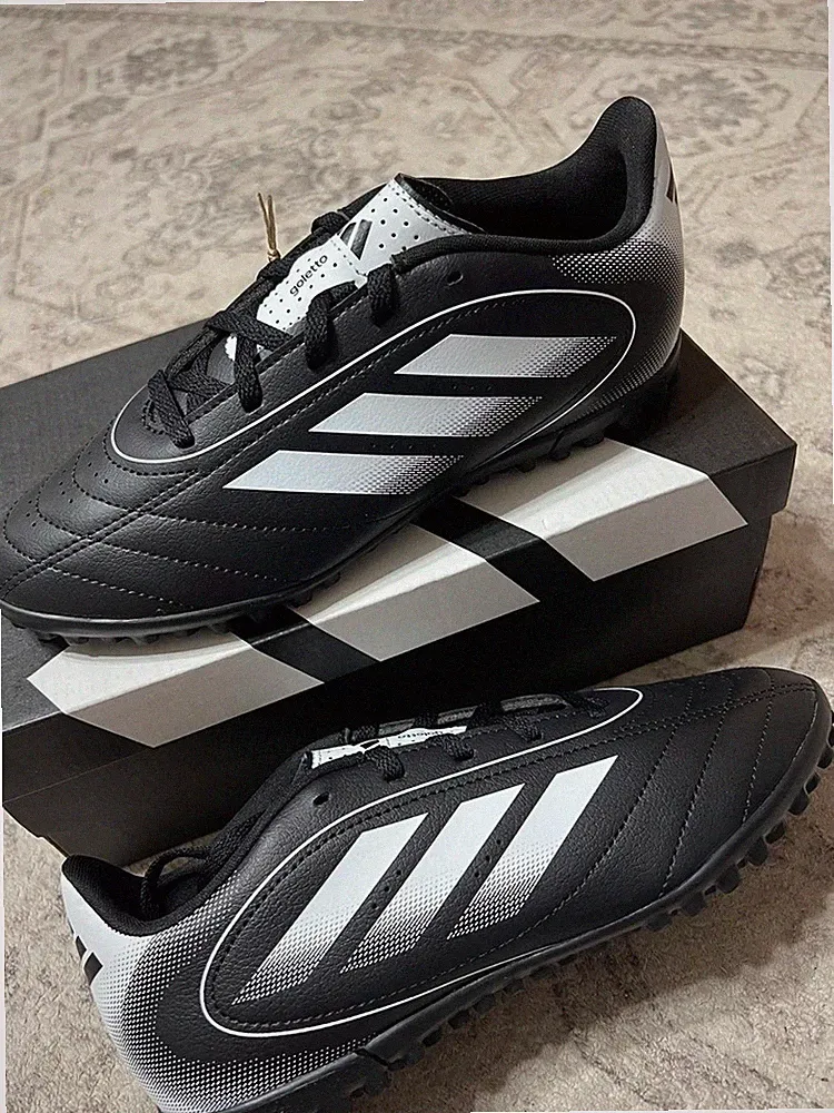 black and white Adidas Goletto IX turf soccer cleats