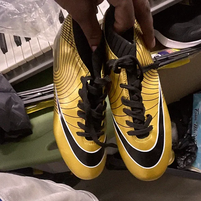 Gold and Black Football Soccer Cleats with Studded Sole for Outdoor Sports