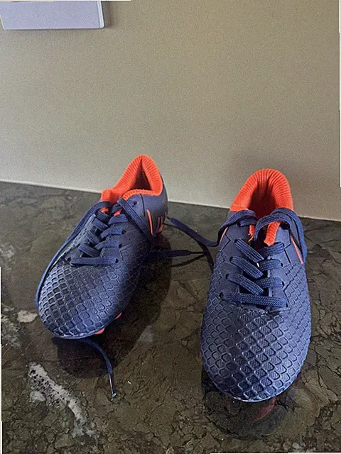Hawkwell Kids Soccer Cleats – Size 11.5C. Navy blue with bright orange accents.