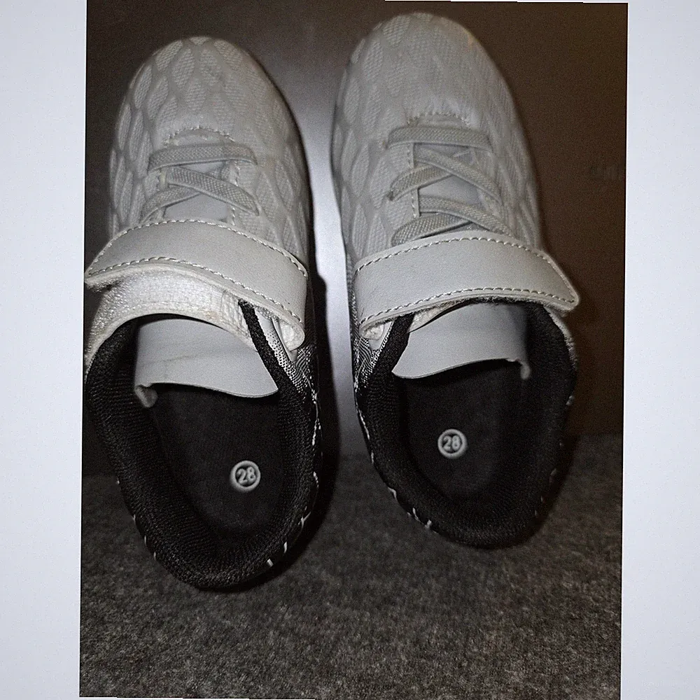 Kids / toddler molded-stud athletic soccer and turf cleats.
