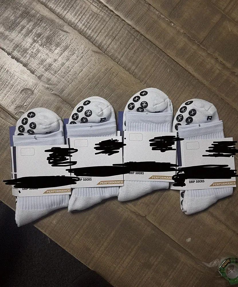**LIQUIDATING** white performance soccer grip socks. SIZE SMALL and MEDIUM