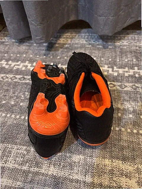 mens soccer cleats black And Orange