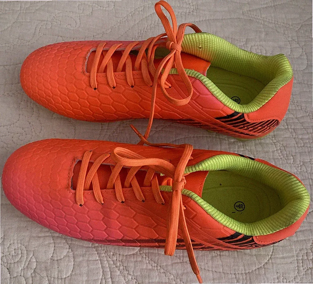 Pink , Orange and Yellow Soccer Cleats with Hexagonal Pattern