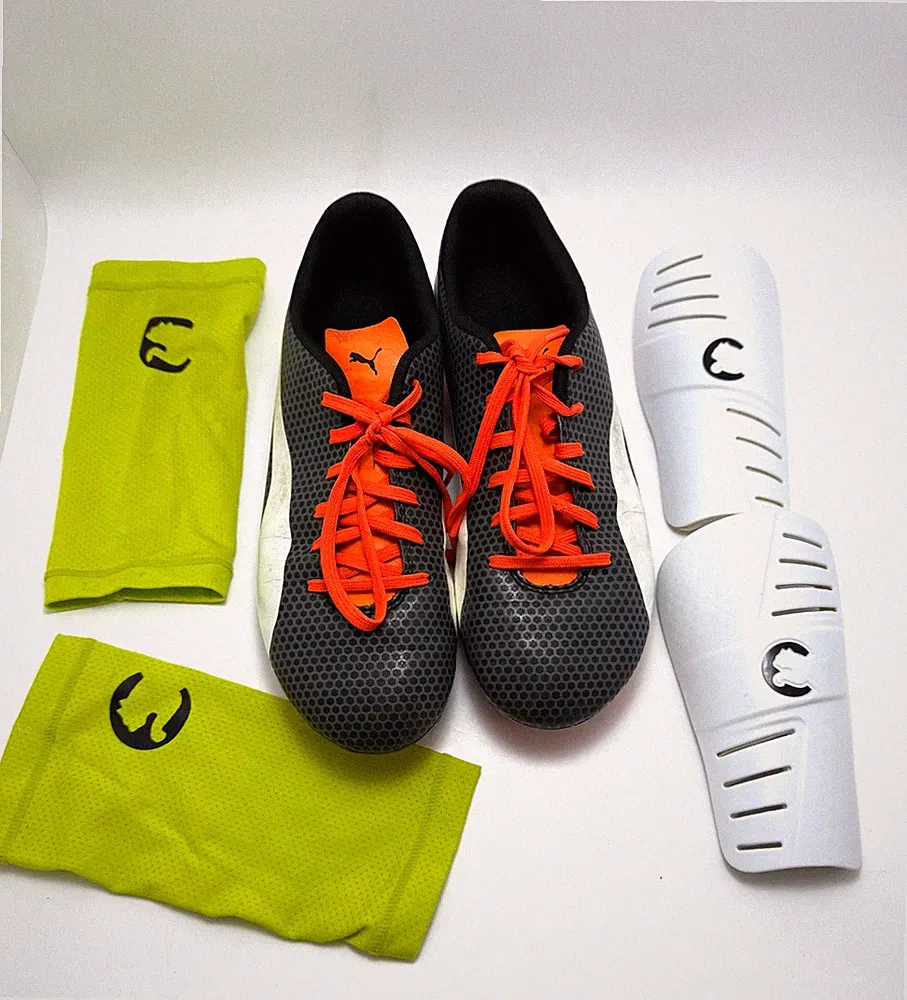 Puma Firm Ground Soccer Cleats | Size 8 Black White orange with Shin Guards