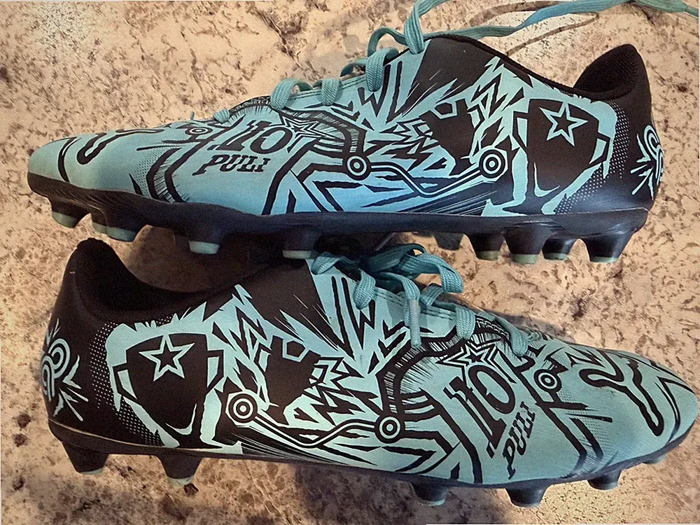 PUMA x Christian Pulisic Unisex Kids' Tacto II Artificial Ground Soccer Cleats H