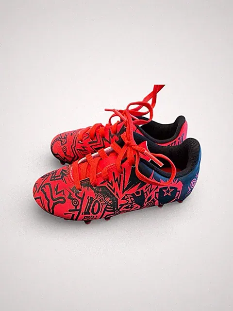 PUMA x Christian Pulisic Unisex Kids' Tacto II Artificial Ground Soccer Cleats R