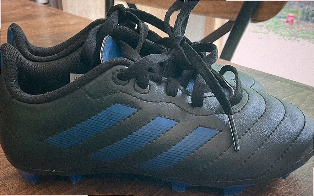 Size 12.5 kids adidas soccer cleats in excellent condition. Black and blue