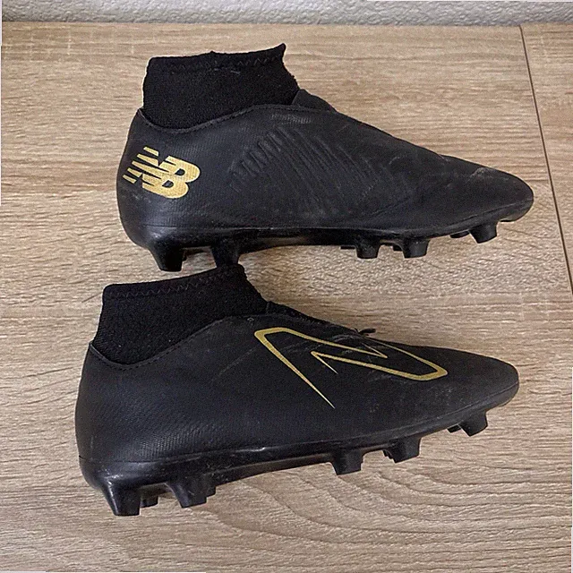 Used New Balance Tekela V4 Magique JNR FG soccer cleat