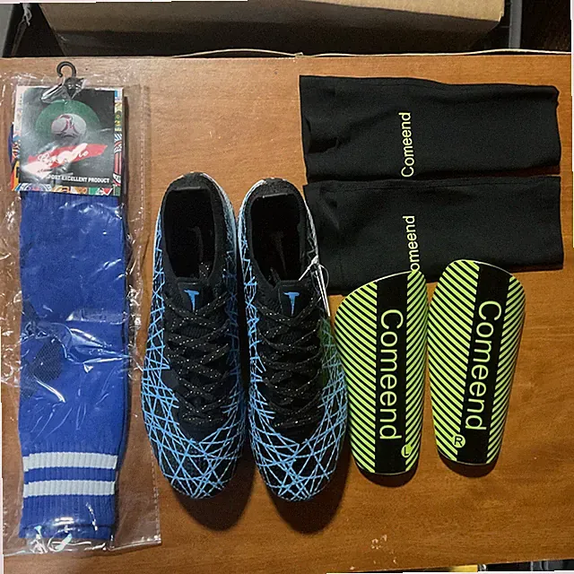 Youth Size 6 Soccer Cleats With Shin Guards, Socks, And Arm Sleeves